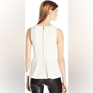 H&M, size XS, white peplum top with long back zipper, fitted. Sleeveless